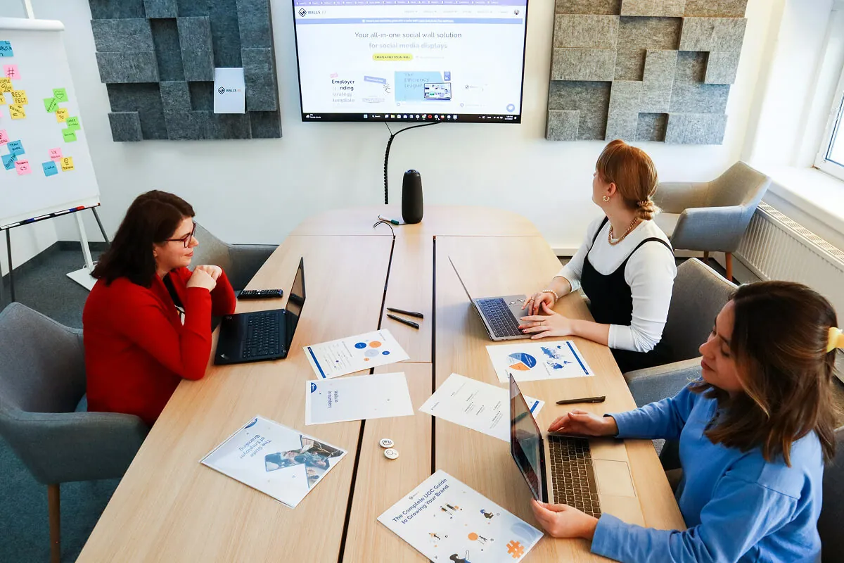 ai agent development services in bangalore — team collaborating on whiteboard - Photo by Moe Magners on Pexels