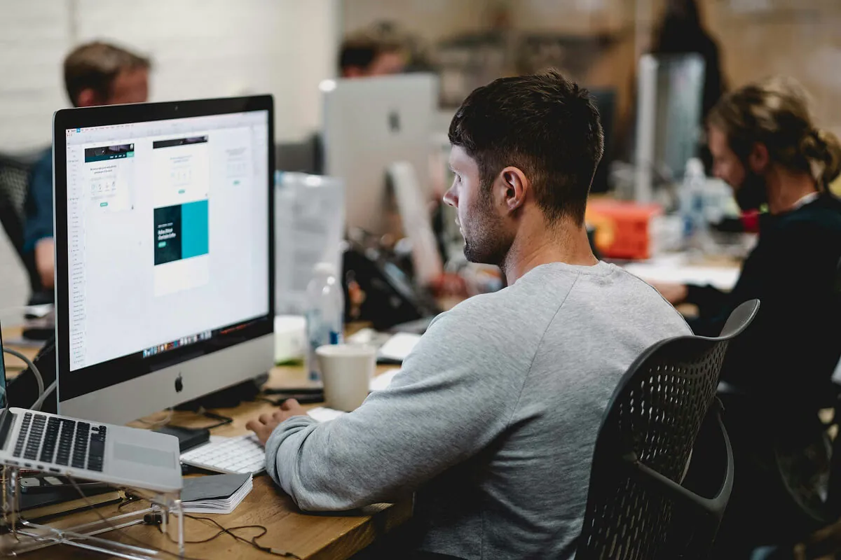 ai development agency in usa — developer working on code at desk - Photo by ThisIsEngineering on Pexels