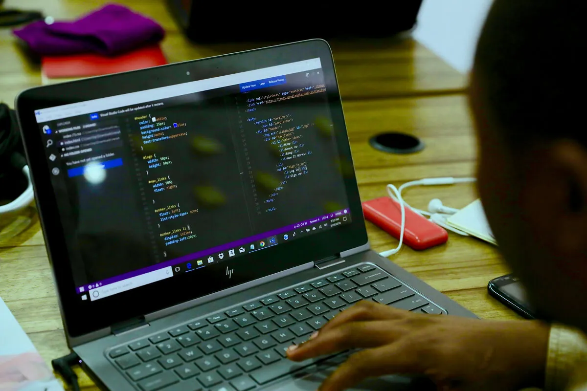 ai-powered software development and modernization — developer working on code at desk - Photo by cottonbro studio on Pexels