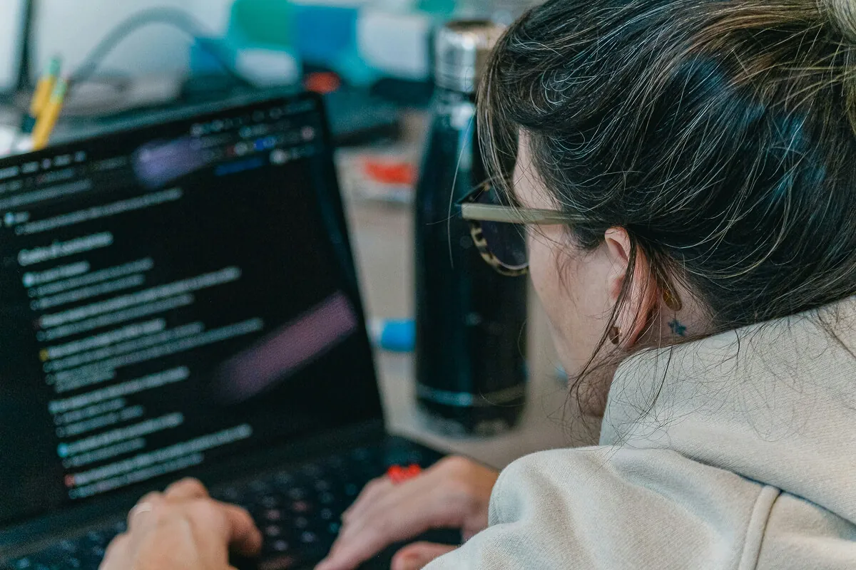 ai agent development using python — developer working on code at desk - Photo by Zayed Hossain on Pexels